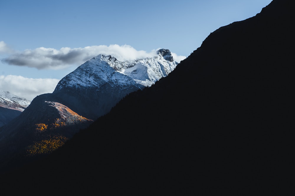 mountain covered with snow and fog