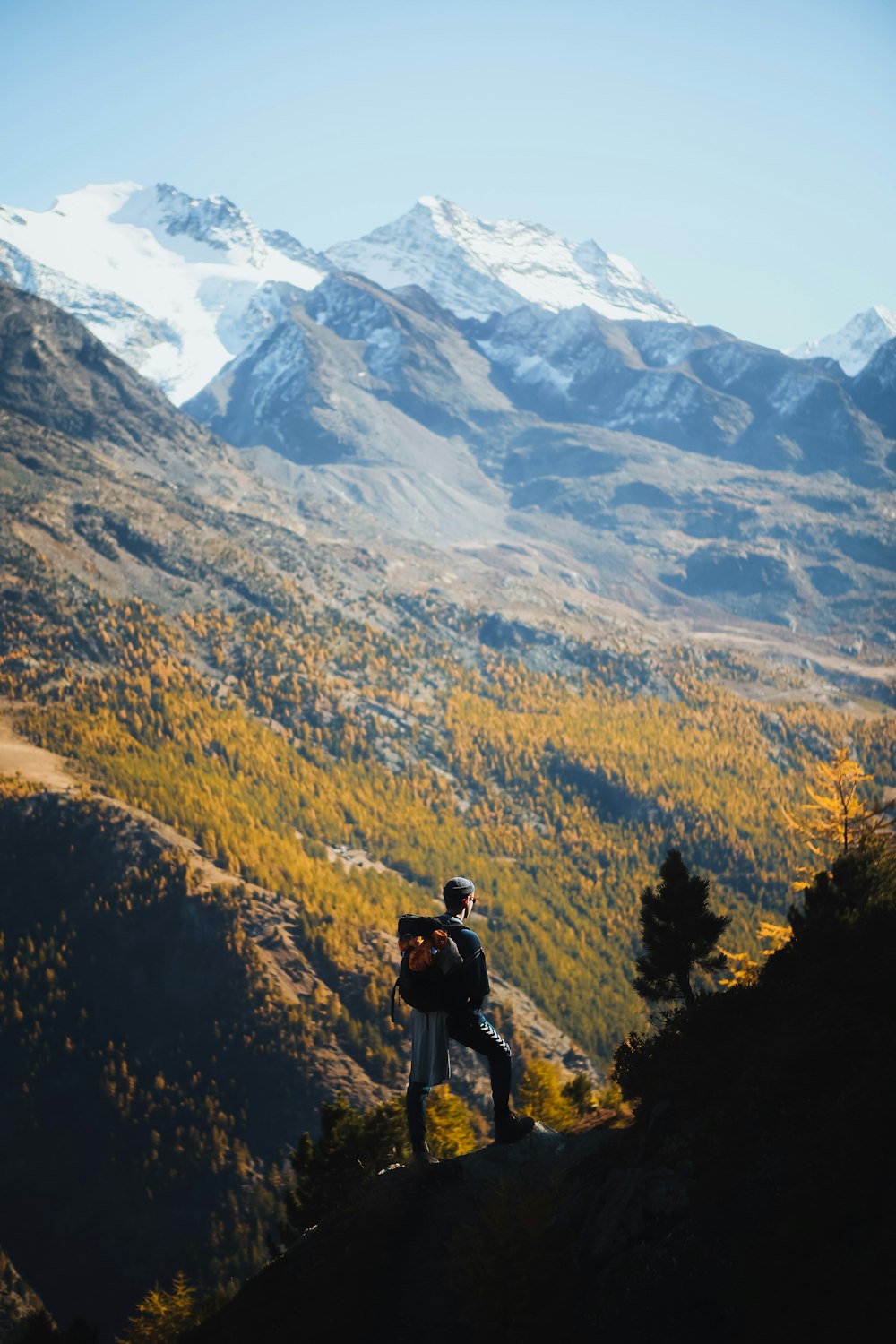 person wearing cap across mountains