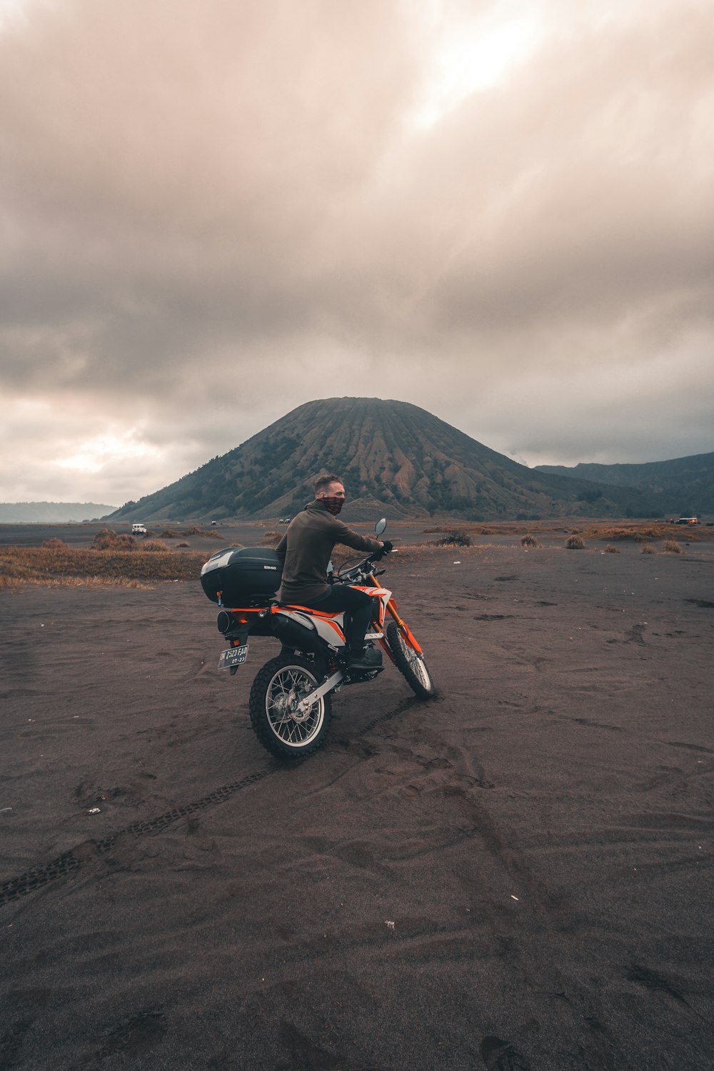 man riding motorcycle near mountain