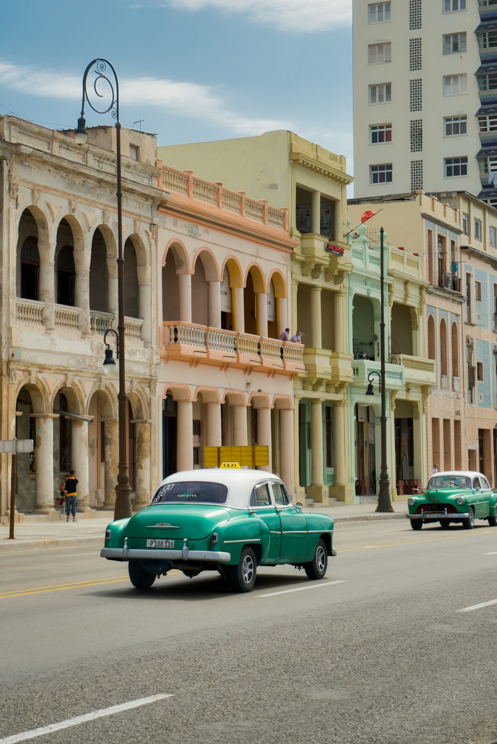 green car on road