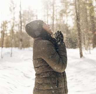 woman standing on snow field