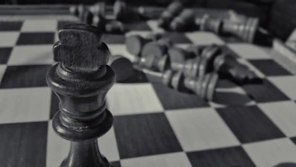 Close-up of a dark blue chess piece symbolizing strategic financial planning.