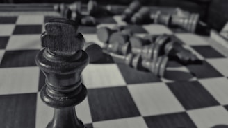 Close-up of a golden chess piece symbolizing strategic business moves on a dark marble surface.