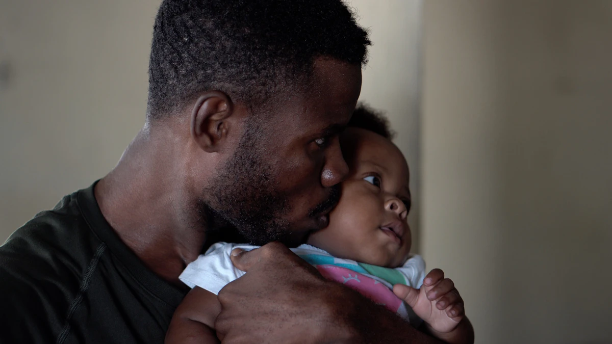 A father kissing his baby's face