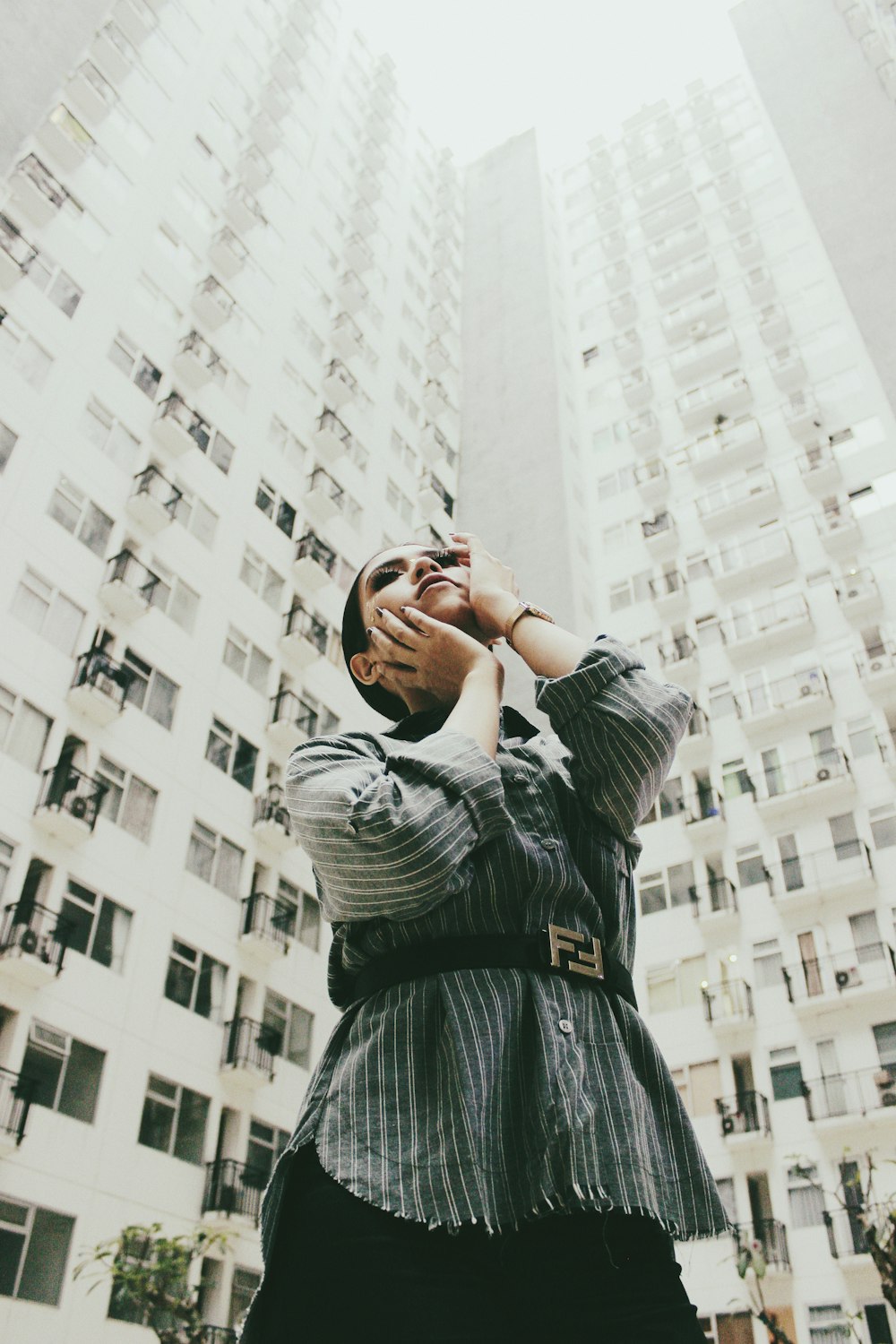 shallow focus photo of woman wearing black Fendi leather belt