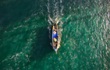 A dynamic collage of popular boating and fishing influencers using promoted gear in action-packed shots