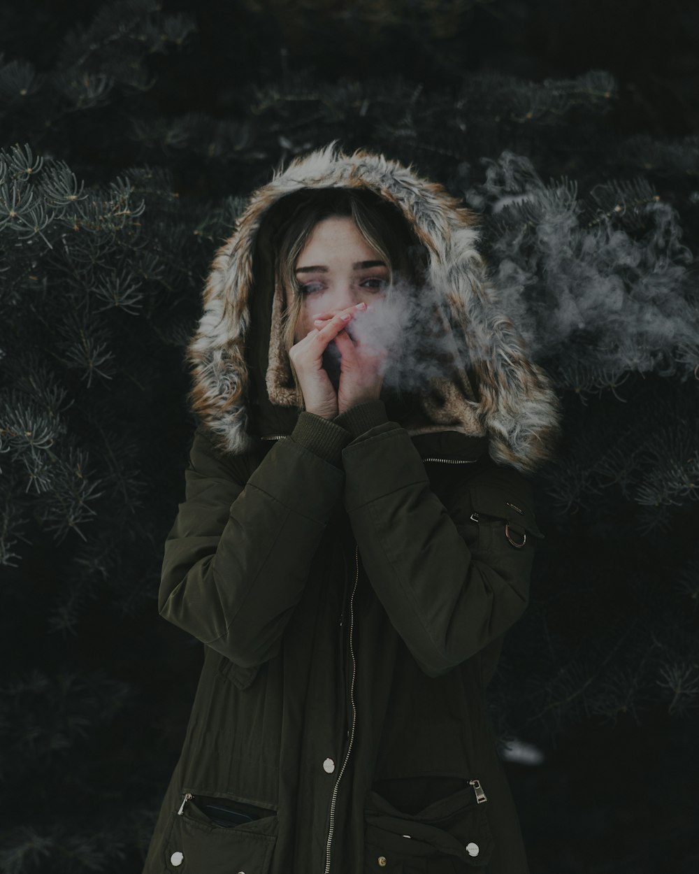 woman wearing green winter coat