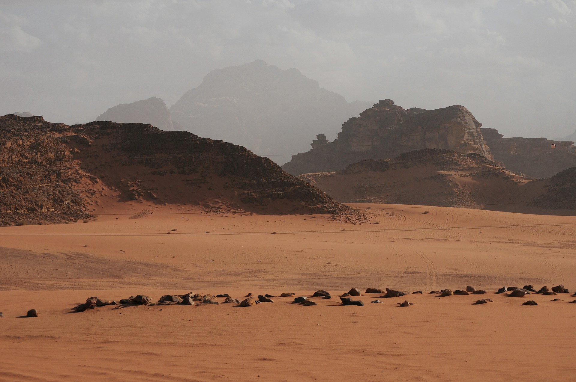 brown desert bounded by hills