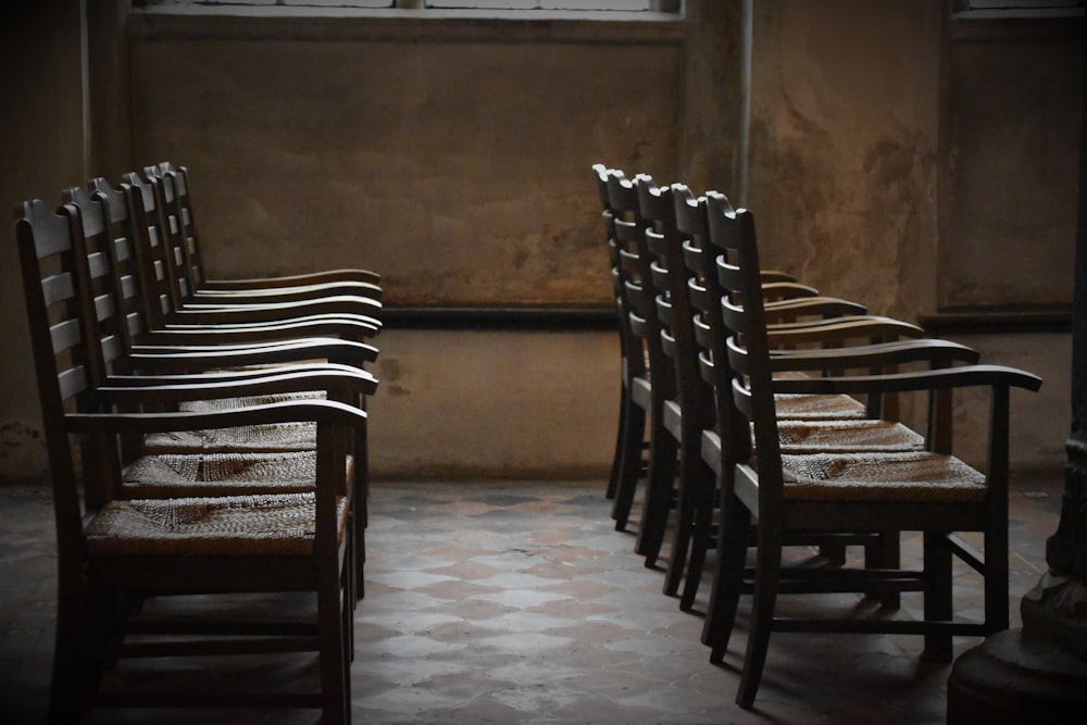 empty brown wooden armchairs