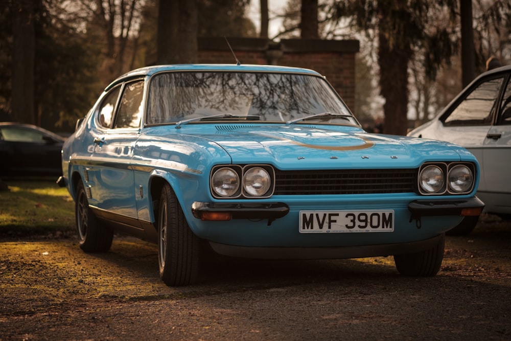 blue coupe parked