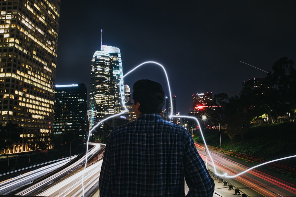 man standing near buildings