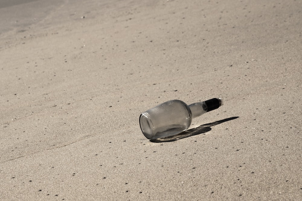 empty bottle on sand