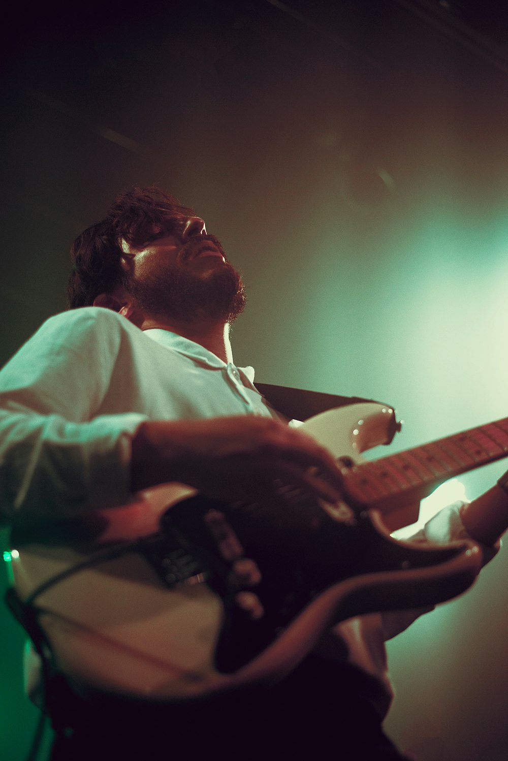 man playing electric guitar