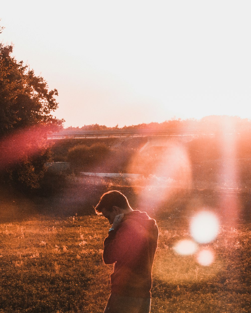 man standing on grass field