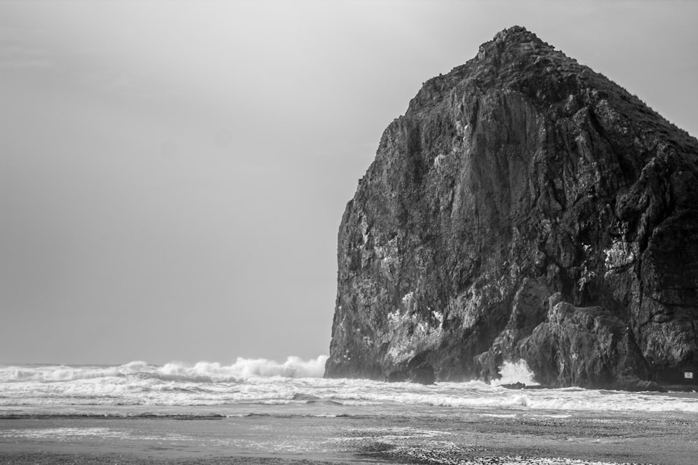 grayscale photo of large-size stone