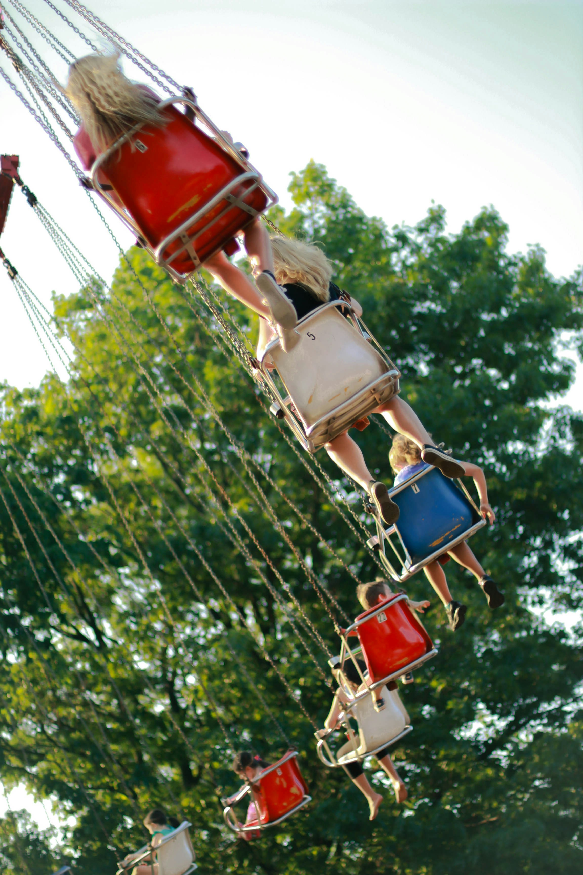 people riding Marry Go Round at daytime