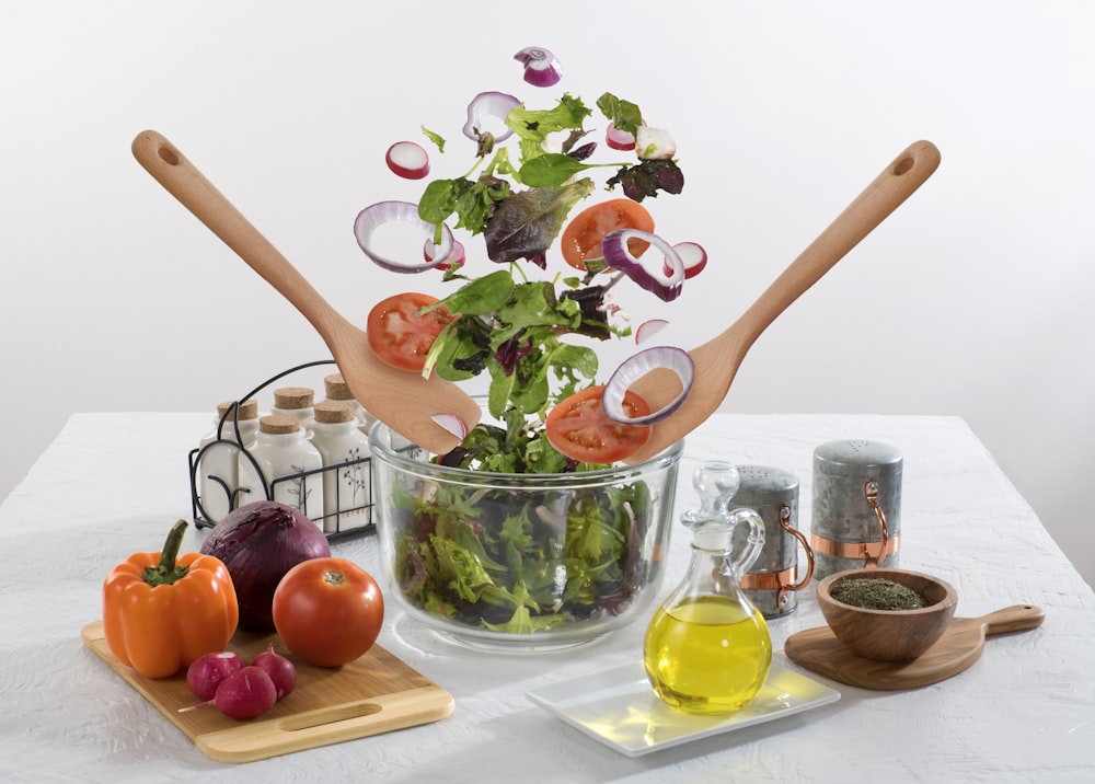 assorted vegetables with spatula and ladle on table