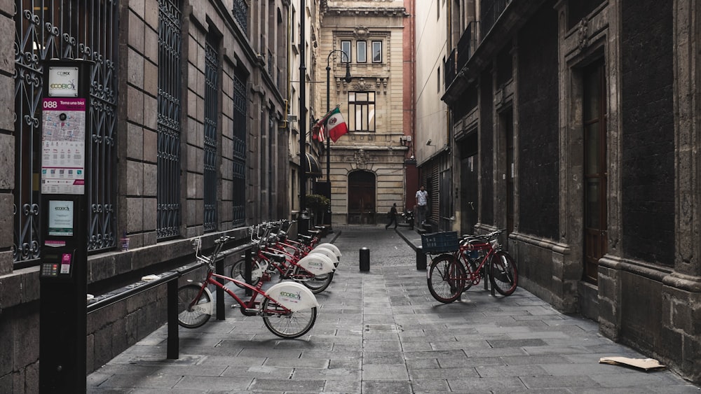 bikes between buildings during daytime