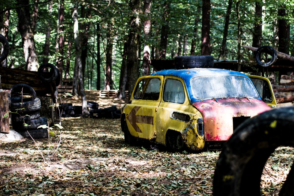 wrench yellow and red car surrounded by trees