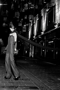 A model wearing a chic, elegant outfit in a bright, modern setting.