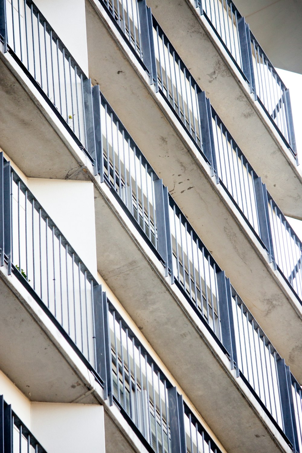 low angle photography of metal building rails