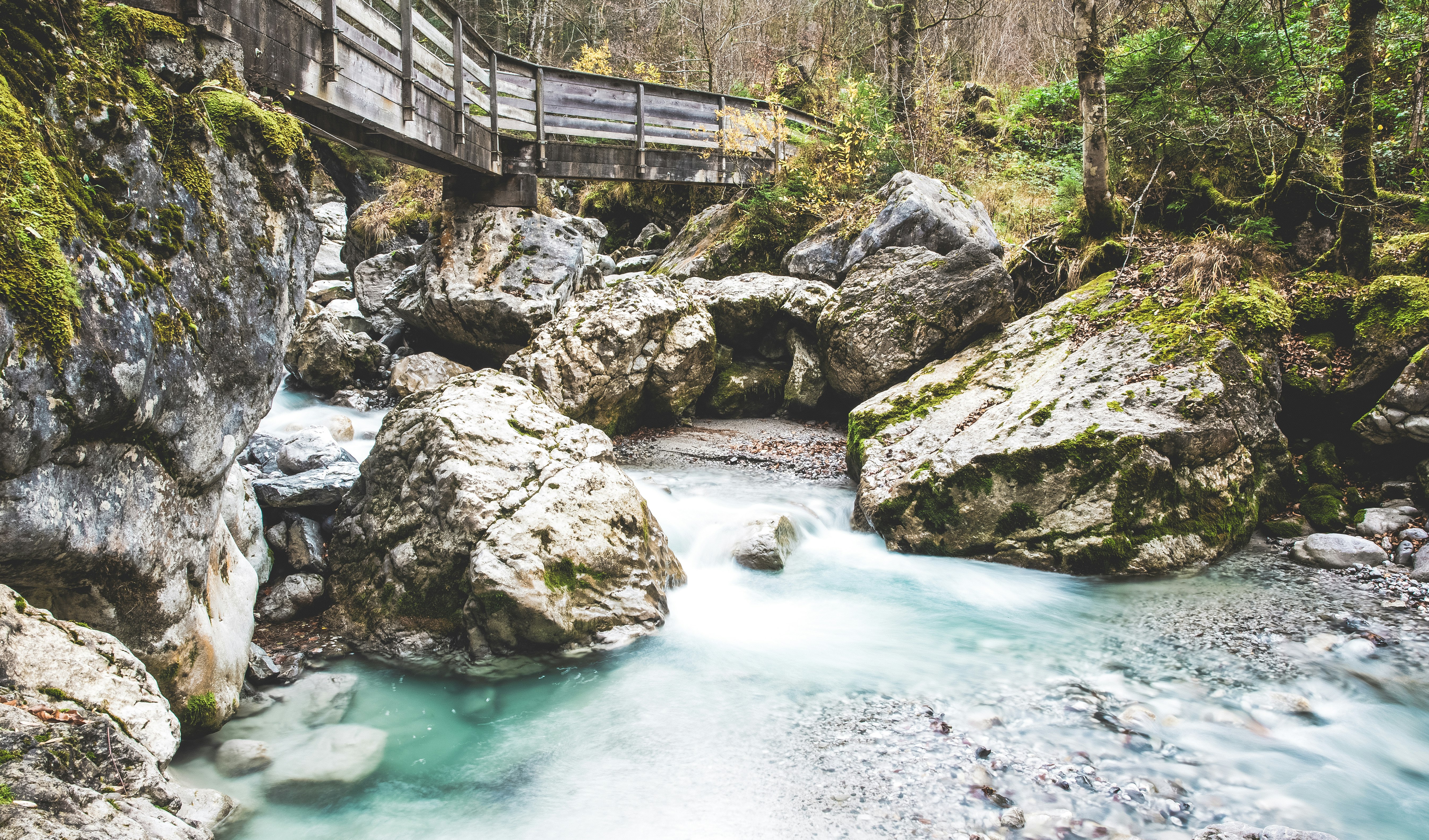 body of water and rocks during daytime