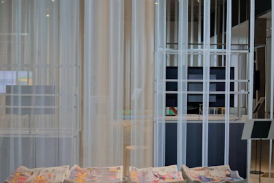 Subtle image of a calm newsroom environment with muted tones and minimal distractions.