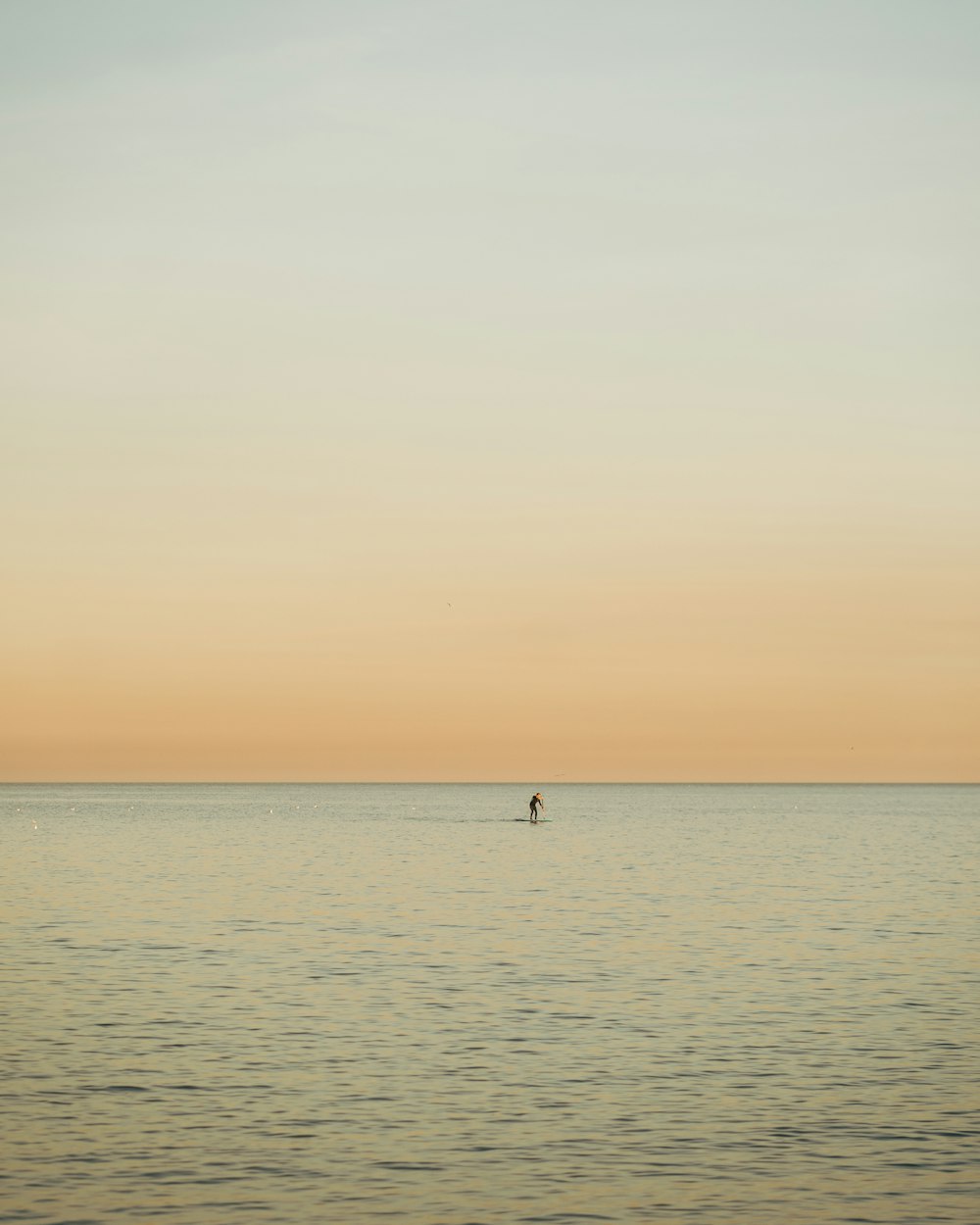 man riding on boat in body of water