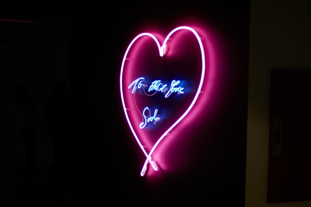 red and blue heart neon signage