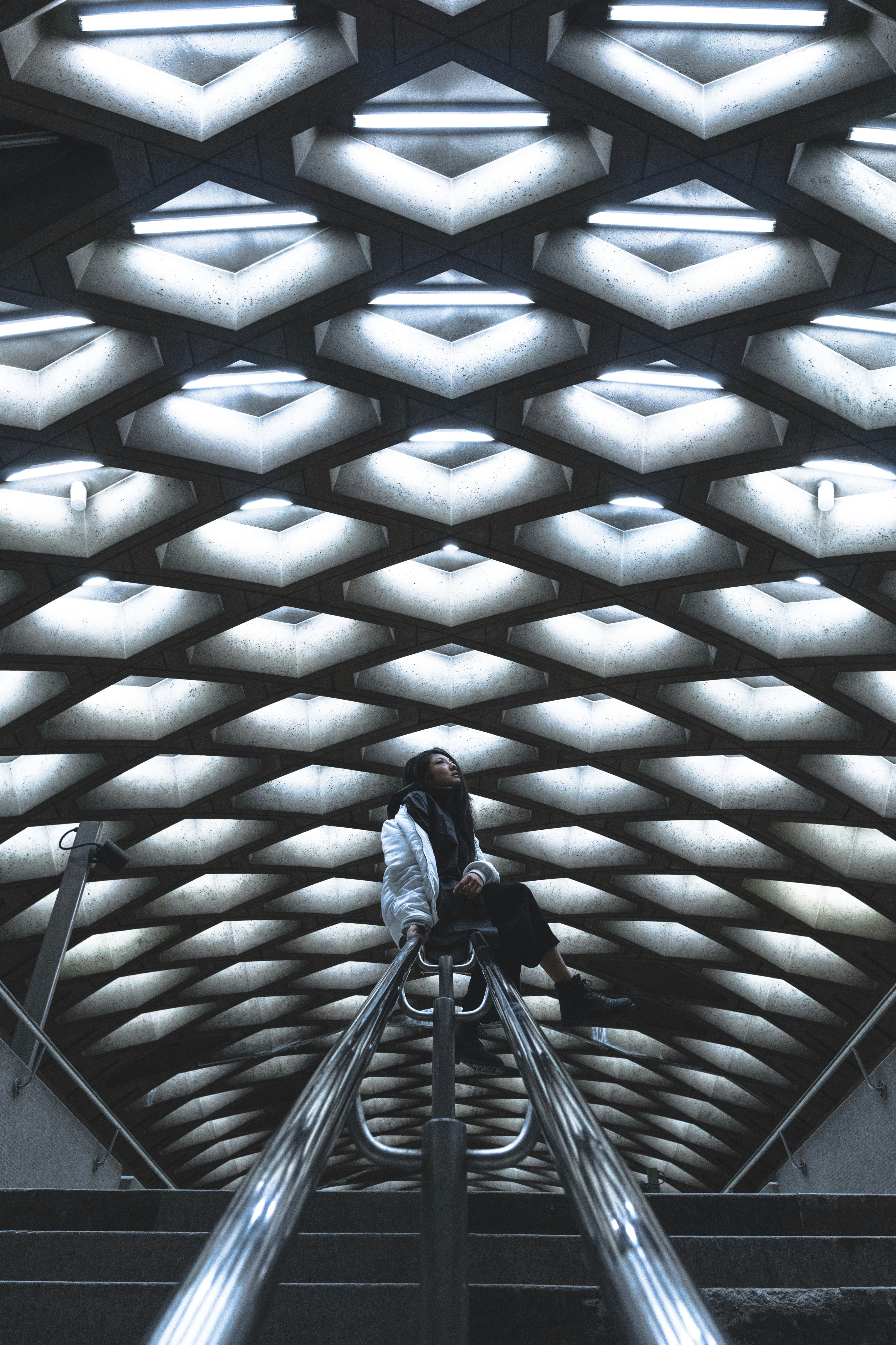 woman sitting on railing