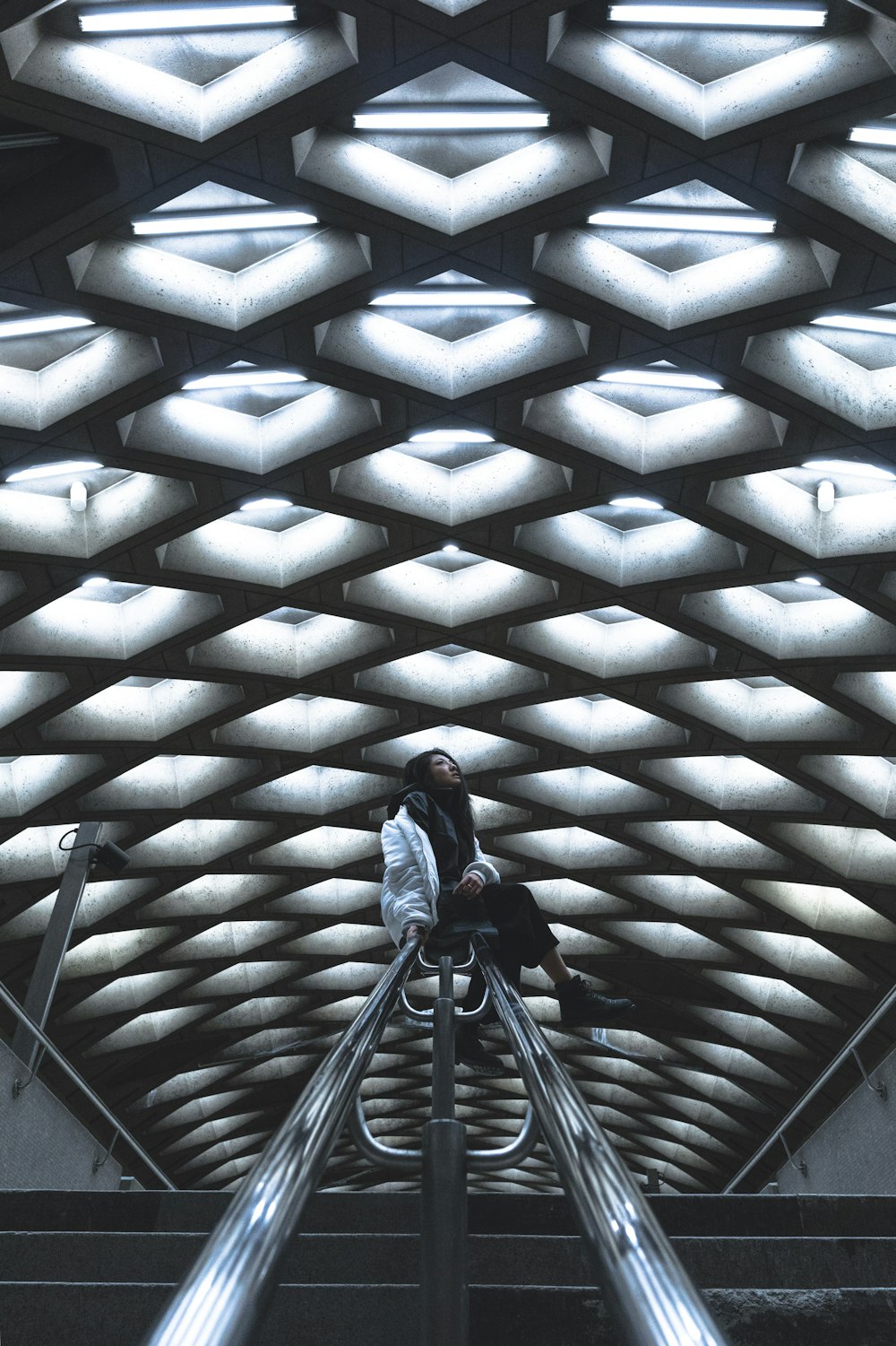 woman sitting on railing