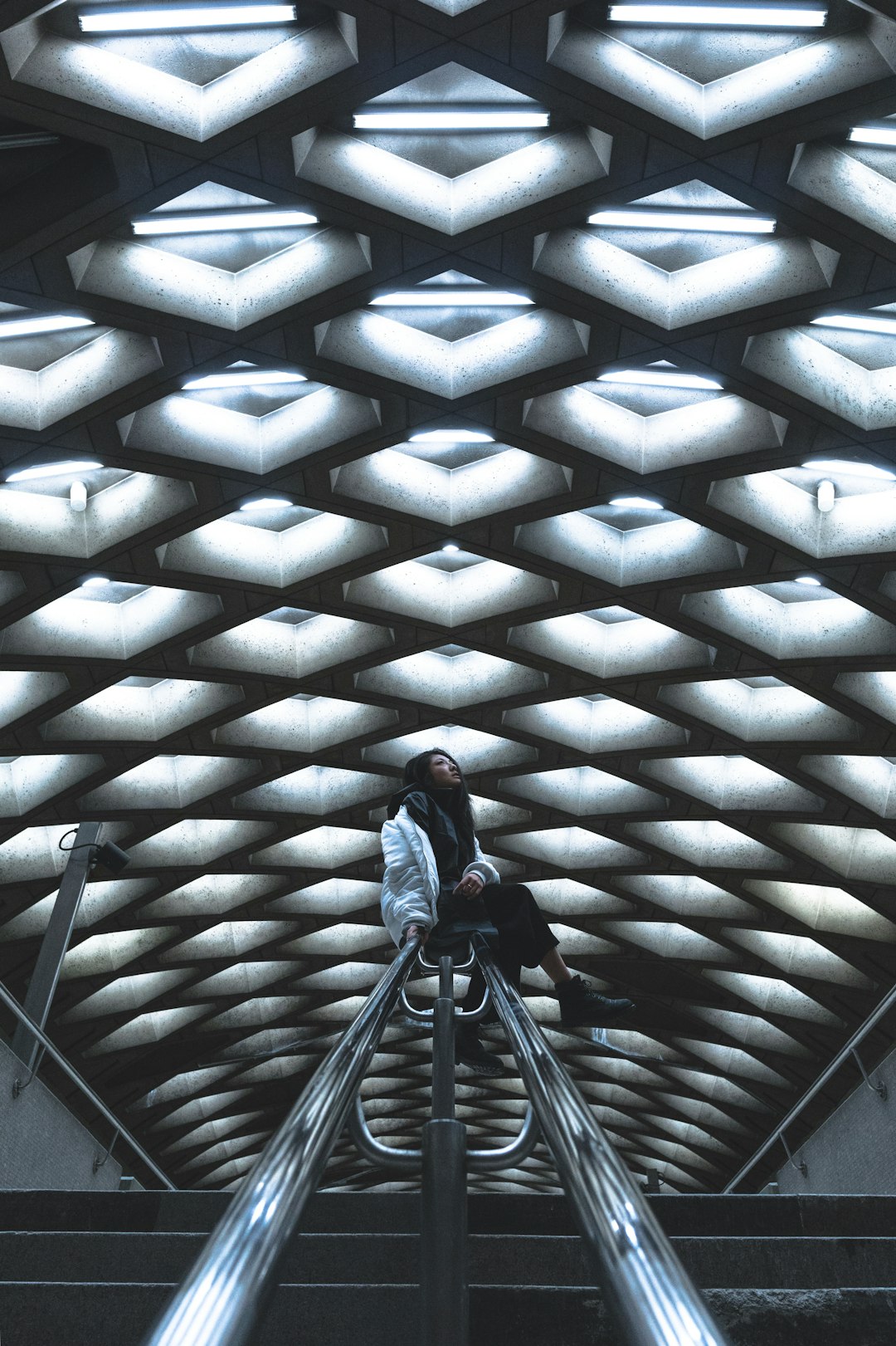 woman sitting on railing