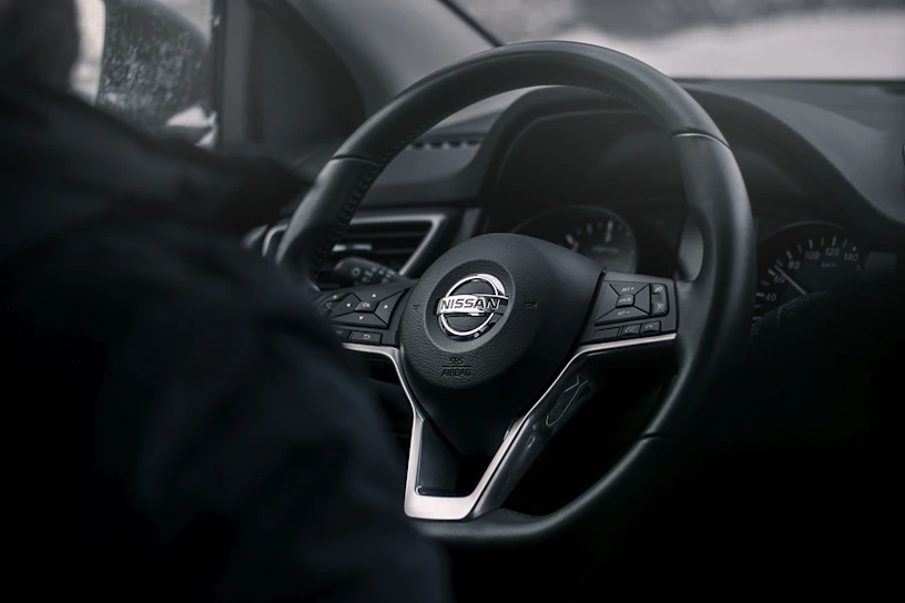 Close-up of a sleek Nissan Skyline GTR dashboard displaying Haltech tuning software in action.