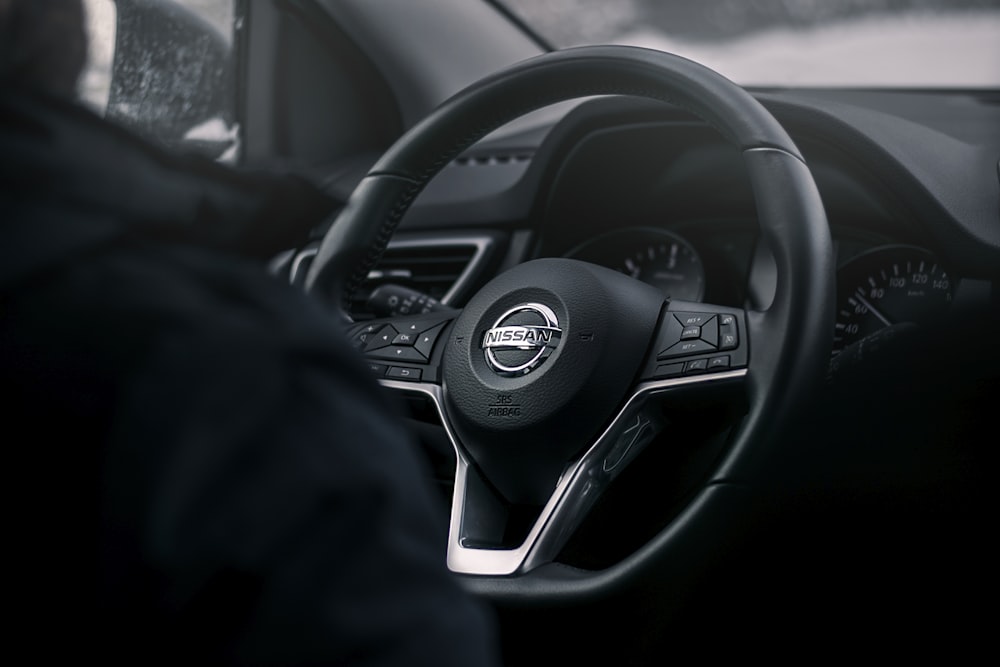 black Nissan steering wheel