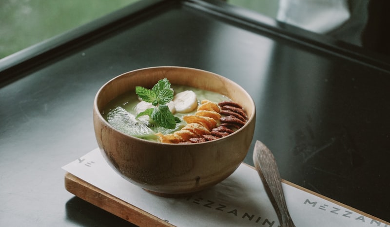 A rustic bowl of onion soup with bread