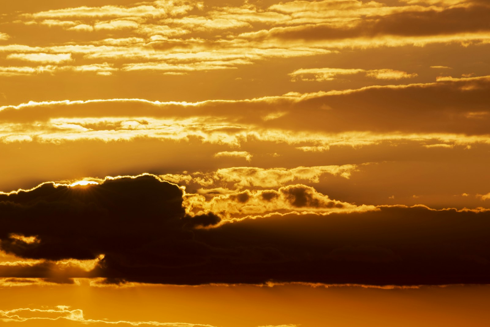 Nikon D5500 + Sigma 70-300mm F4-5.6 APO DG Macro sample photo. Cloud formation during golden photography