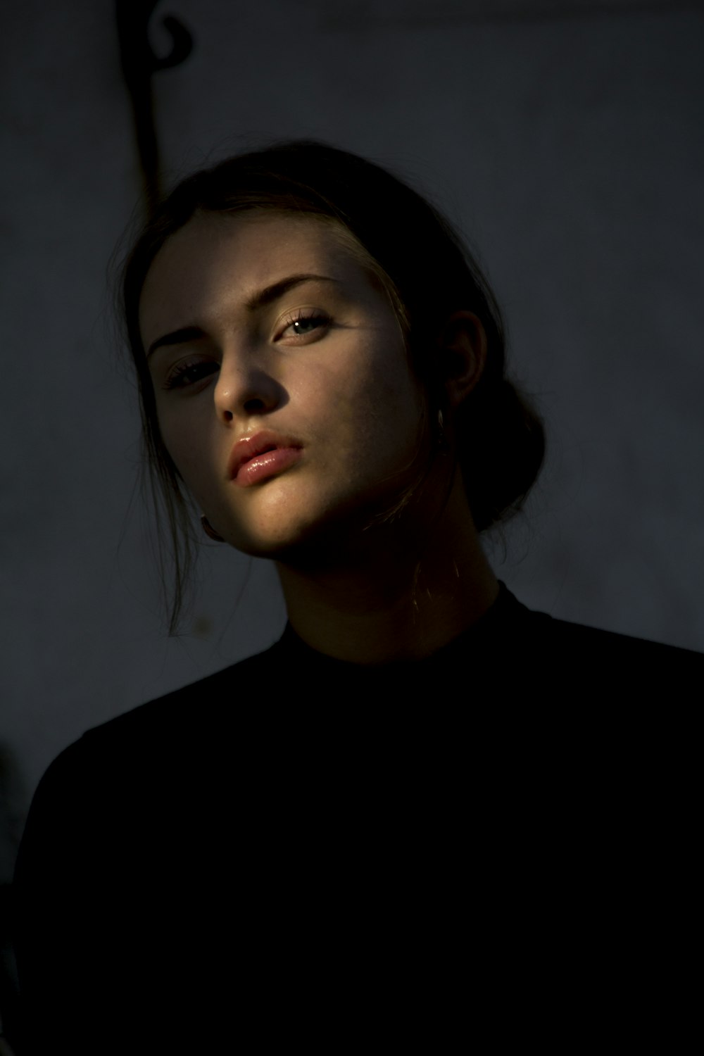 woman wearing black crew-neck top