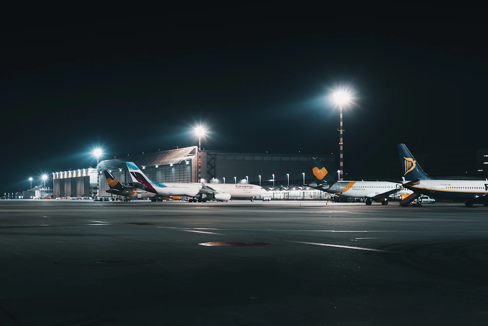 Aircraft parked at an airport tarmac during daytime