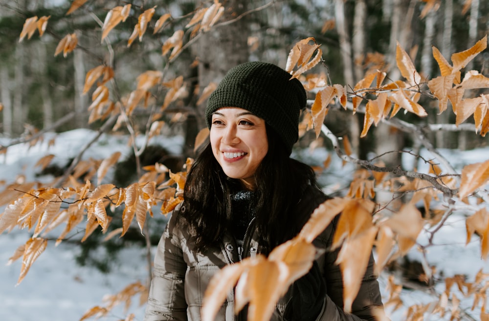 woman in gray bobble jacket smiling