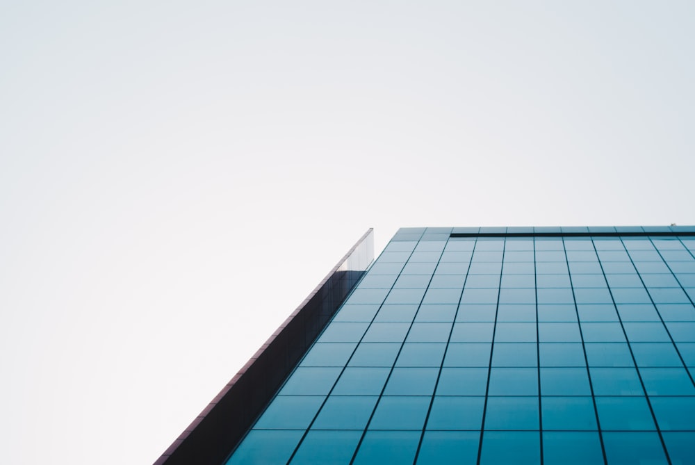 low angle photo of mirror building