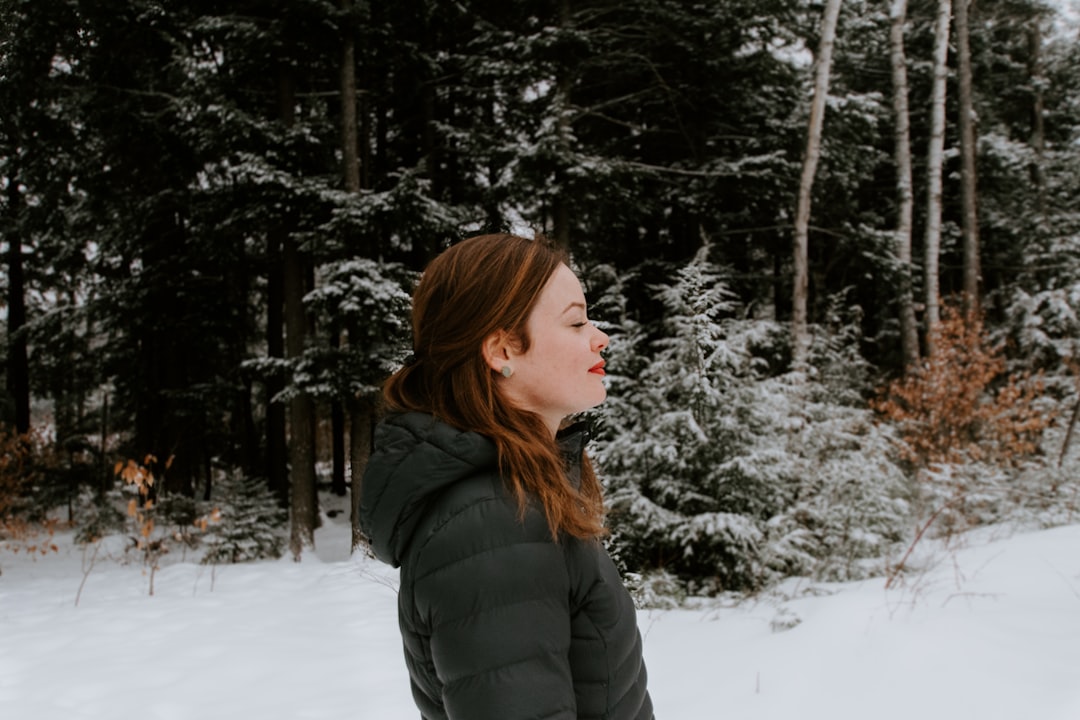 woman in gray bobble jacket closed eyes