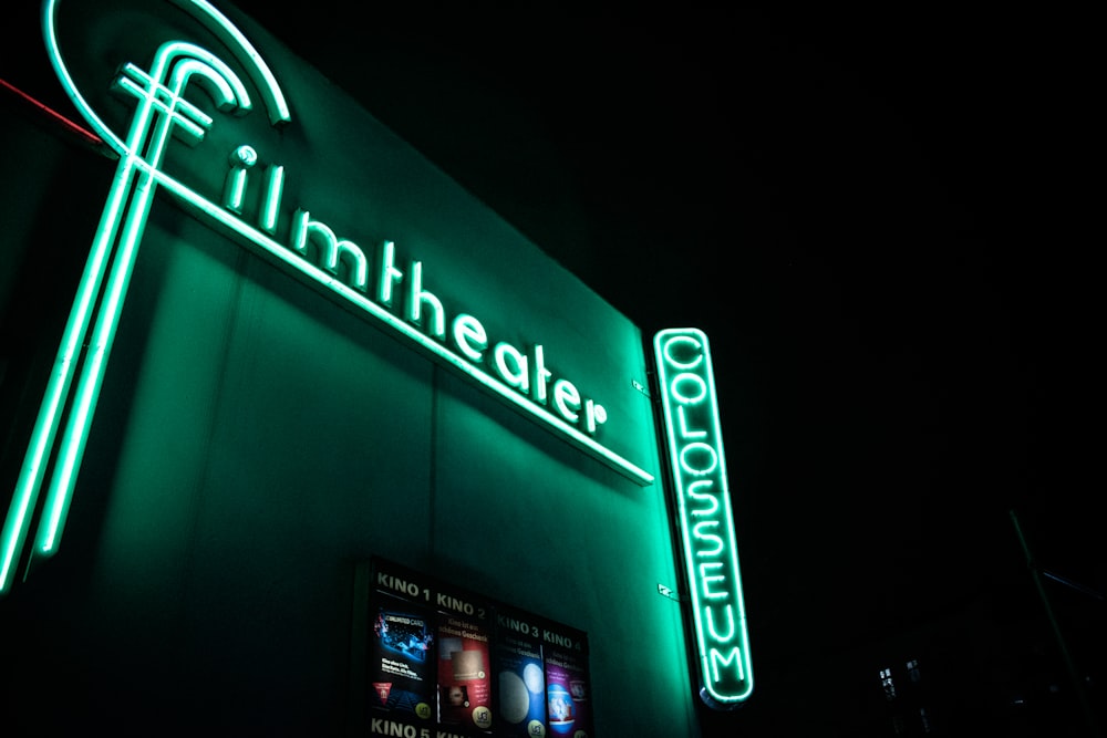green Filmheater LED sign at night