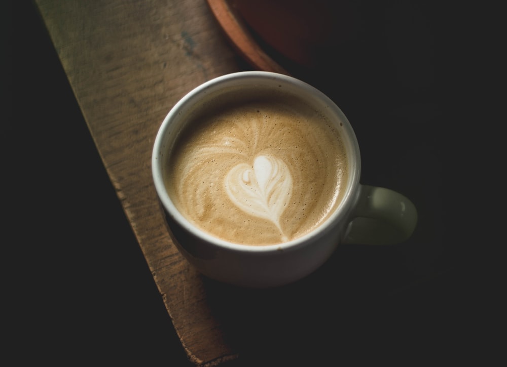 white ceramic mug filled with coffee