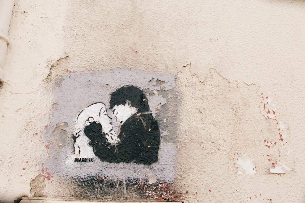 painting of couple on wall