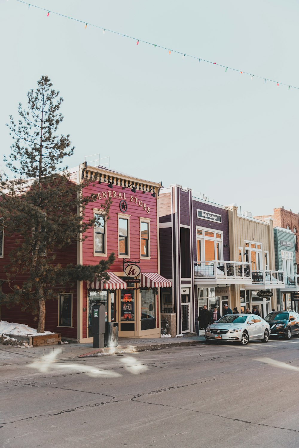 cars parked in front of store front