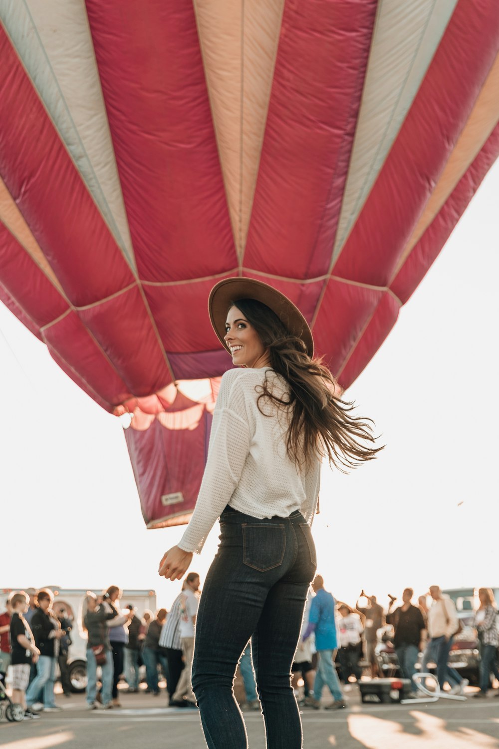 woman standing near hot air balloon during daytime