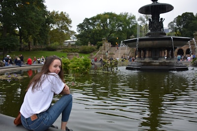 A mentor guiding a young person in a peaceful park setting.