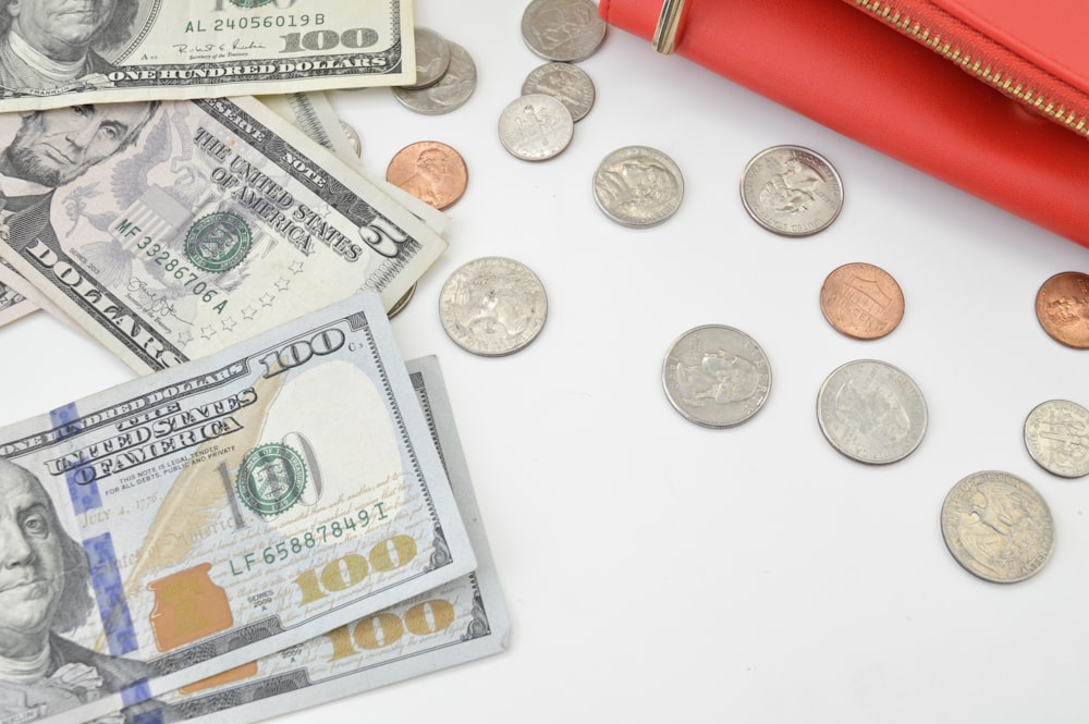 silver round coins and 100 us dollar bill