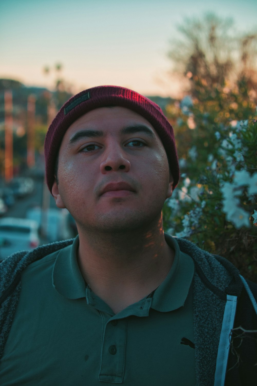 man wearing green collared shirt during golden hour