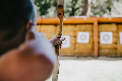 person holding arrow archery google meet background